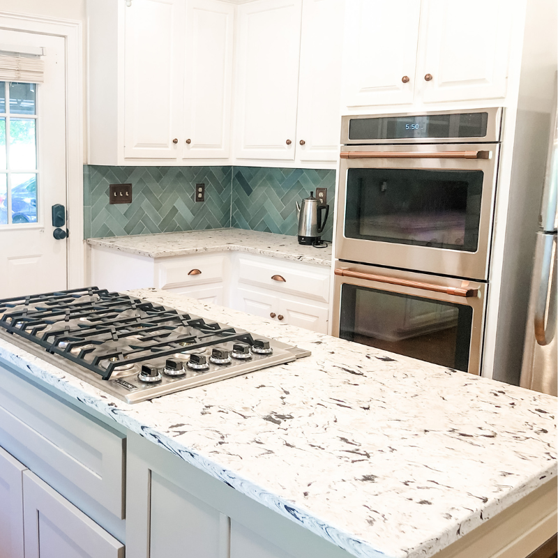 Kitchen With Herringbone Blue Tile Backsplash